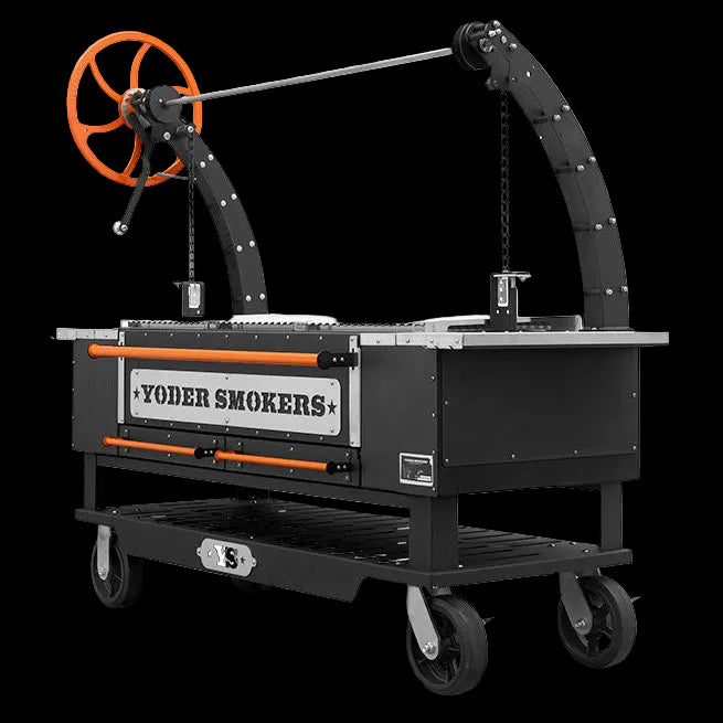 A Yoder Smokers tabletop smoker on wheels, featuring a black metal body, orange accents, and an orange hand wheel for the lid mechanism, shown on a white background.