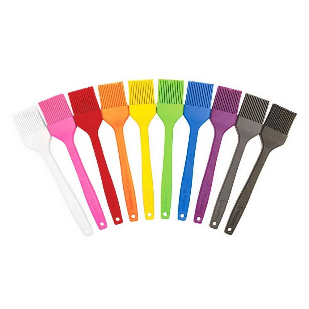 Set of colorful basting brushes on a white background
