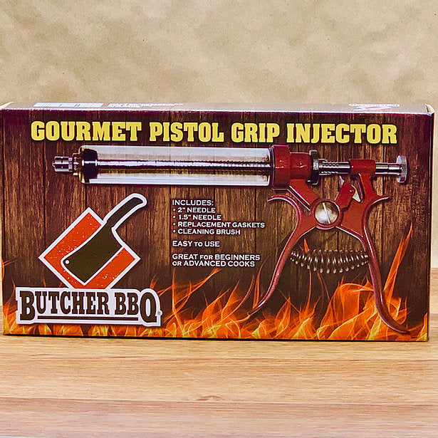 Packaging box for Butcher BBQ's Pistol Grip meat injector, featuring the product image, brand logo, and additional accessories like needles and cleaning brush.